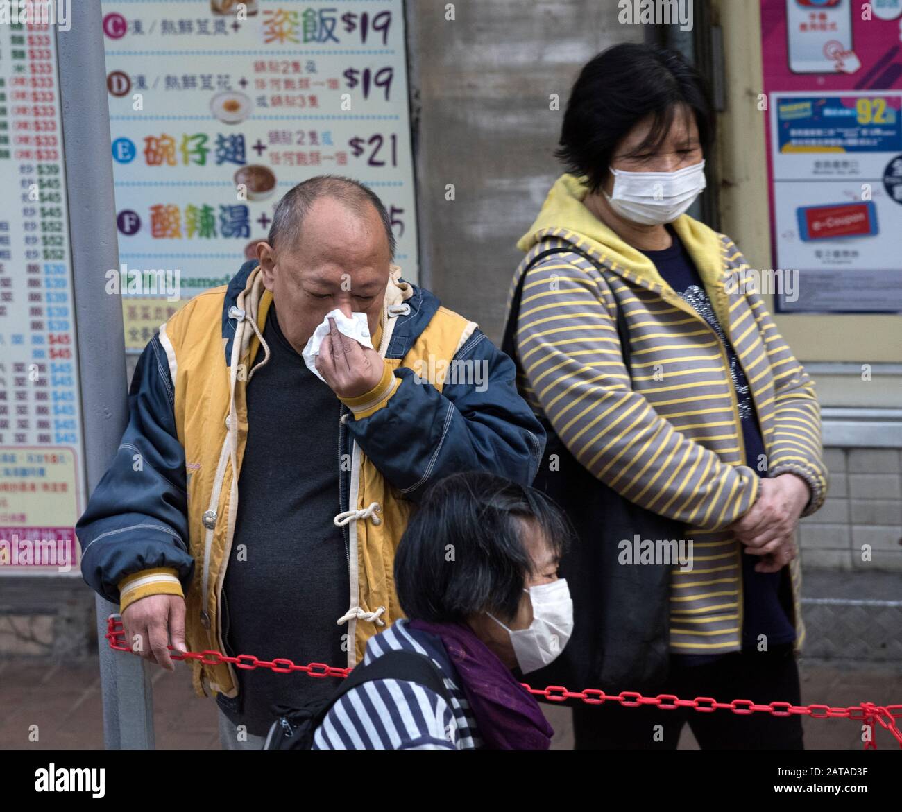 People wearing masks as protection against of the spreading virus from Wuhan, the Coronavirus, 2020, Hong Kong, China. Stock Photo