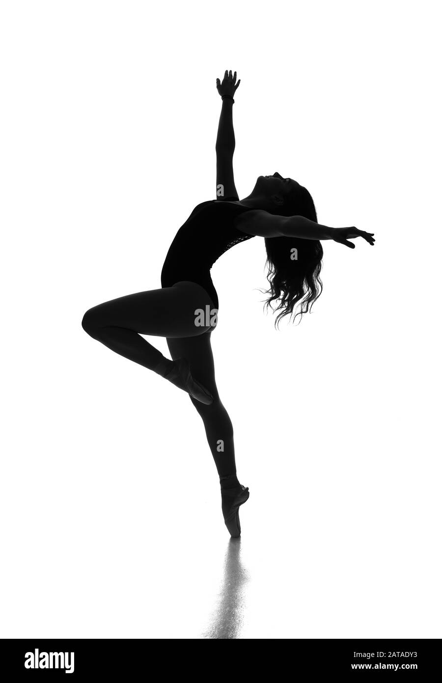 Ballerina en point in silhouette. Stock Photo