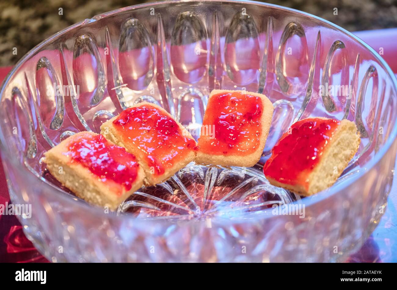 Strawberry red jam on trifle sponge fingers Stock Photo Alamy