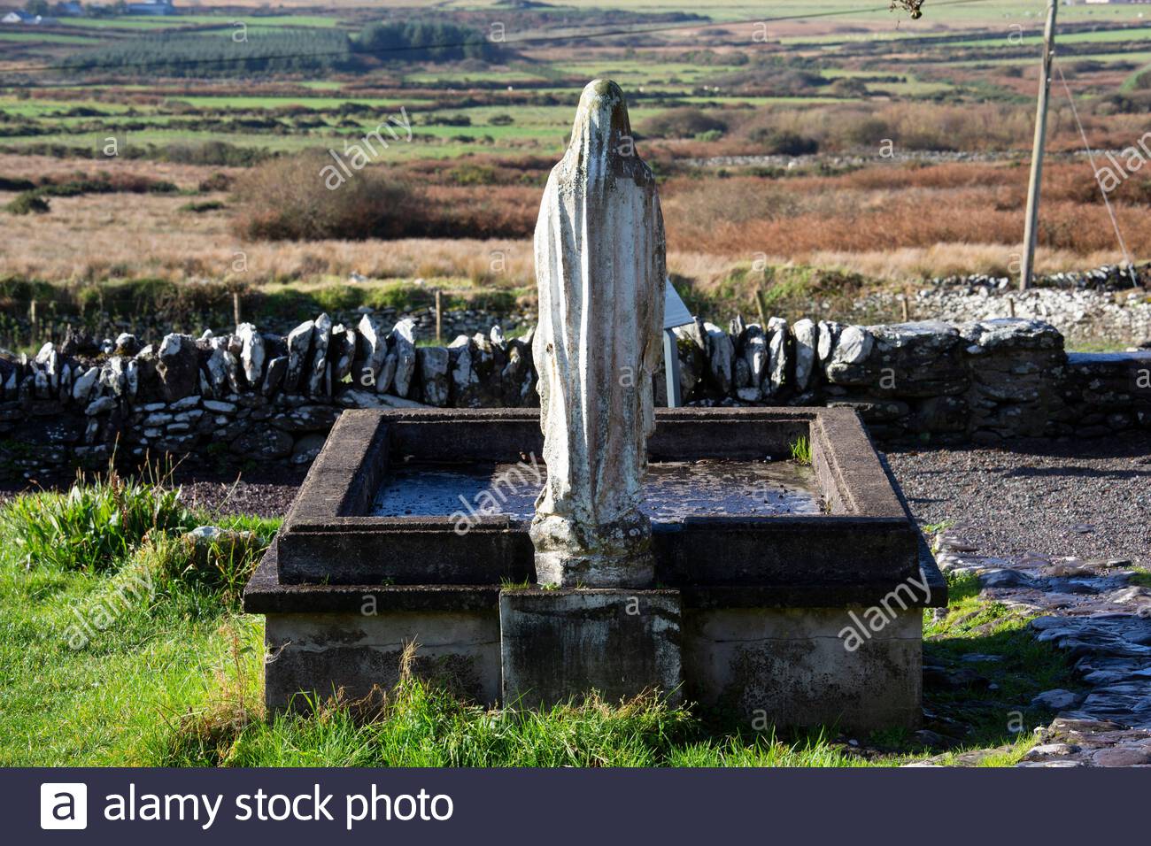 A weathered statue of the Virgin Mary on the Dingle peninsula in