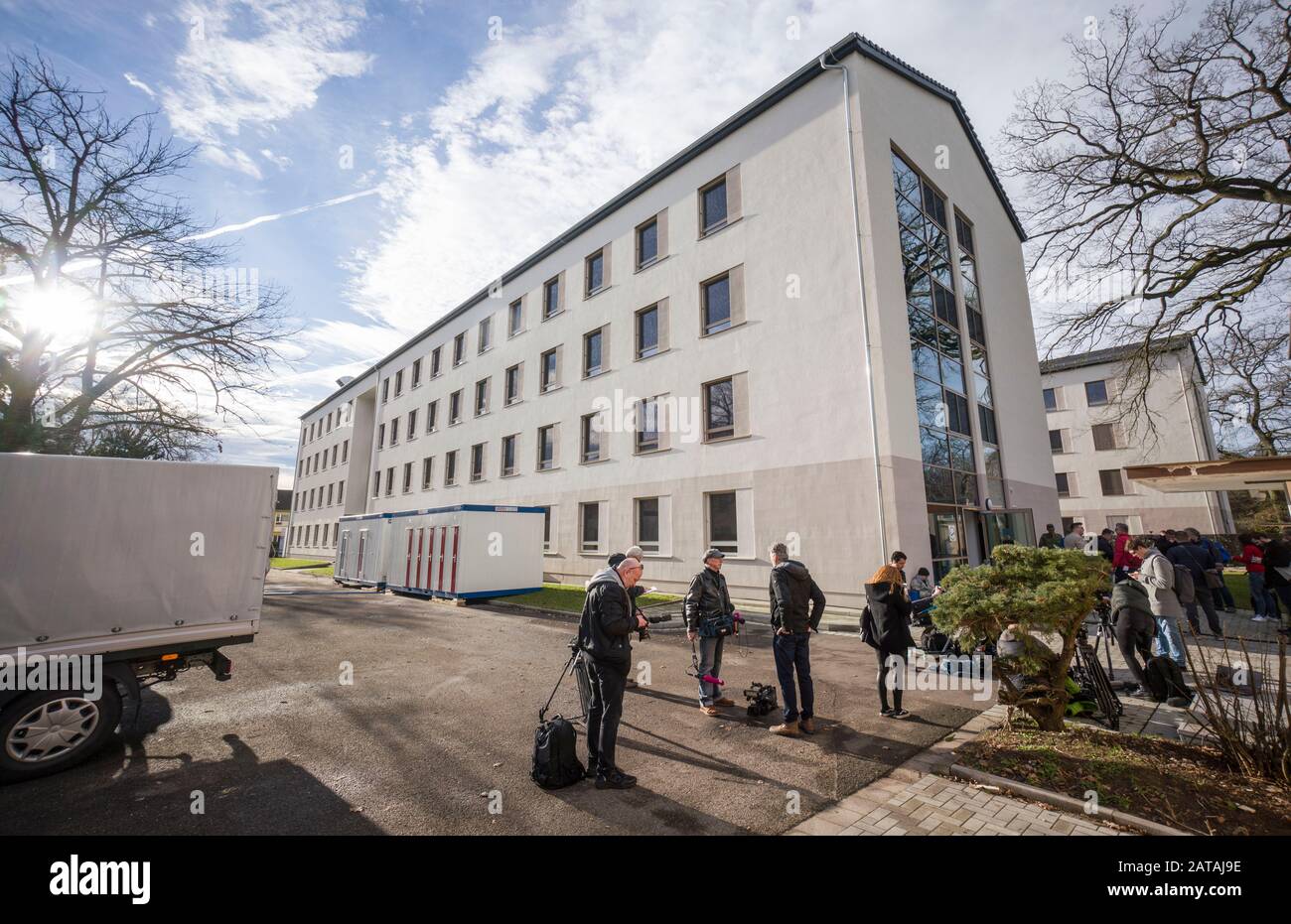 Germersheim, Germany. 01st Feb, 2020. Journalists stand in front of the building on the grounds of the barracks Südpfalz of the German Federal Armed Forces. A plane from China is expected at Frankfurt Airport in the course of the day. Passengers will be briefly looked after there and then taken by bus to Germersheim. For the incubation period of about 14 days they are to be quarantined here. Credit: Frank Rumpenhorst/dpa/Alamy Live News Stock Photo