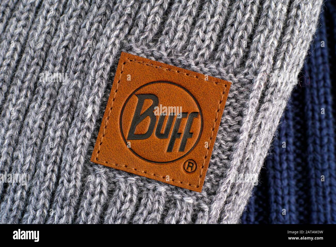 Tambov, Russian Federation - November 16, 2019 Close-up of clothes label Buff on gray knitted hats. Stock Photo