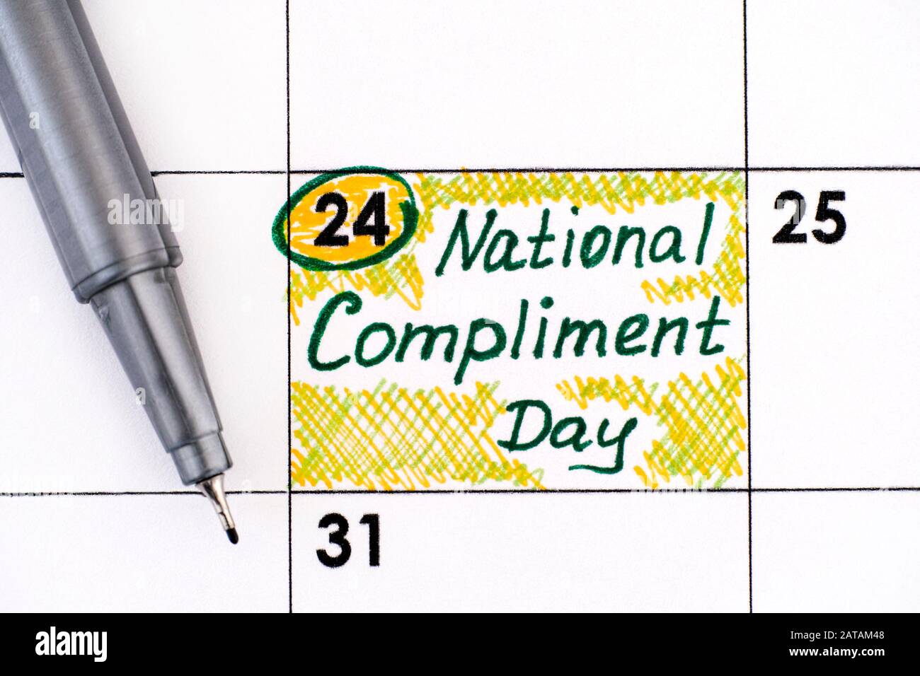 Reminder National Compliment Day in calendar with pen. January 24. Stock Photo