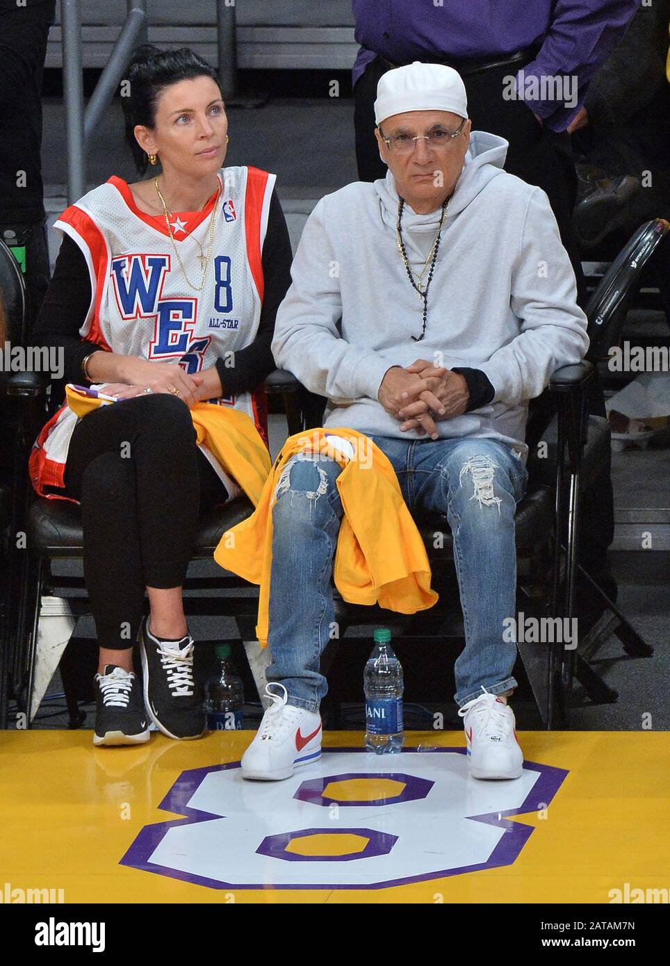 Los Angeles, United States. 31st Jan, 2020. Record producer Jimmy Lovine,  best known as the co-founder of Interscope Records and his wife Liberty  Ross sit court side during the Los Angeles Lakers