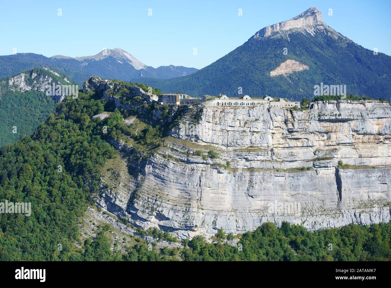 AERIAL VIEW. Military fort of Saint- Eynard standing at the top of a precipitous cliff. Isère, Auvergne-Rhône-Alpes, France. Stock Photo