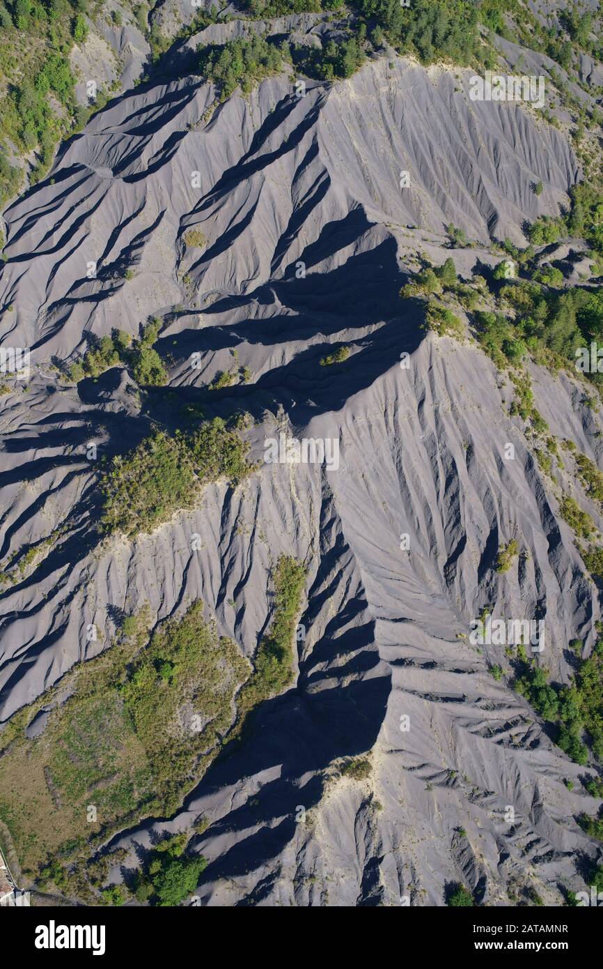 AERIAL VIEW. Badlands of black shale. La Robine-sur-Galabre, Alpes de Haute-Provence, France. Stock Photo
