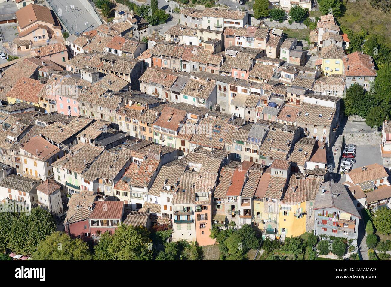 AERIAL VIEW. Small medieval town in the Var Valley of the French Riviera's backcountry. Puget-Théniers, Alpes-Maritimes, France. Stock Photo