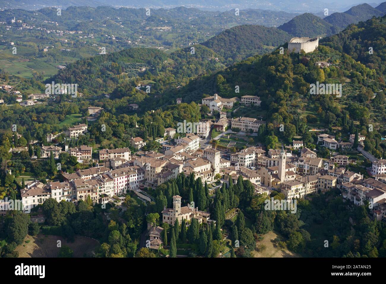 AERIAL VIEW. Picturesque town on green rolling hills. Asolo, Veneto, Italy. Stock Photo