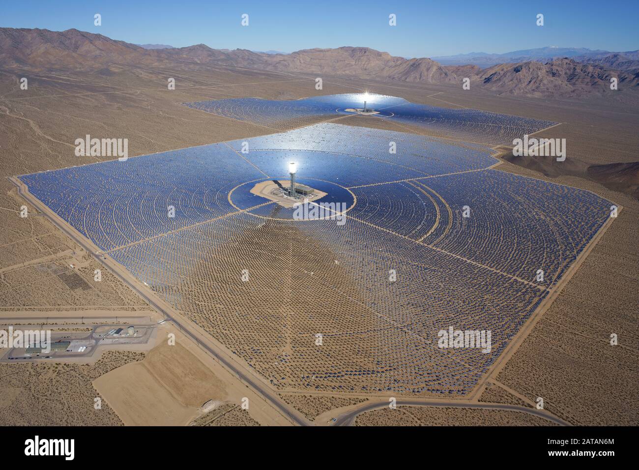 AERIAL VIEW. Ivanpah Solar Electric Generating System (world's largest concentrated solar power plant as of 2018). Mojave Desert, California, USA. Stock Photo