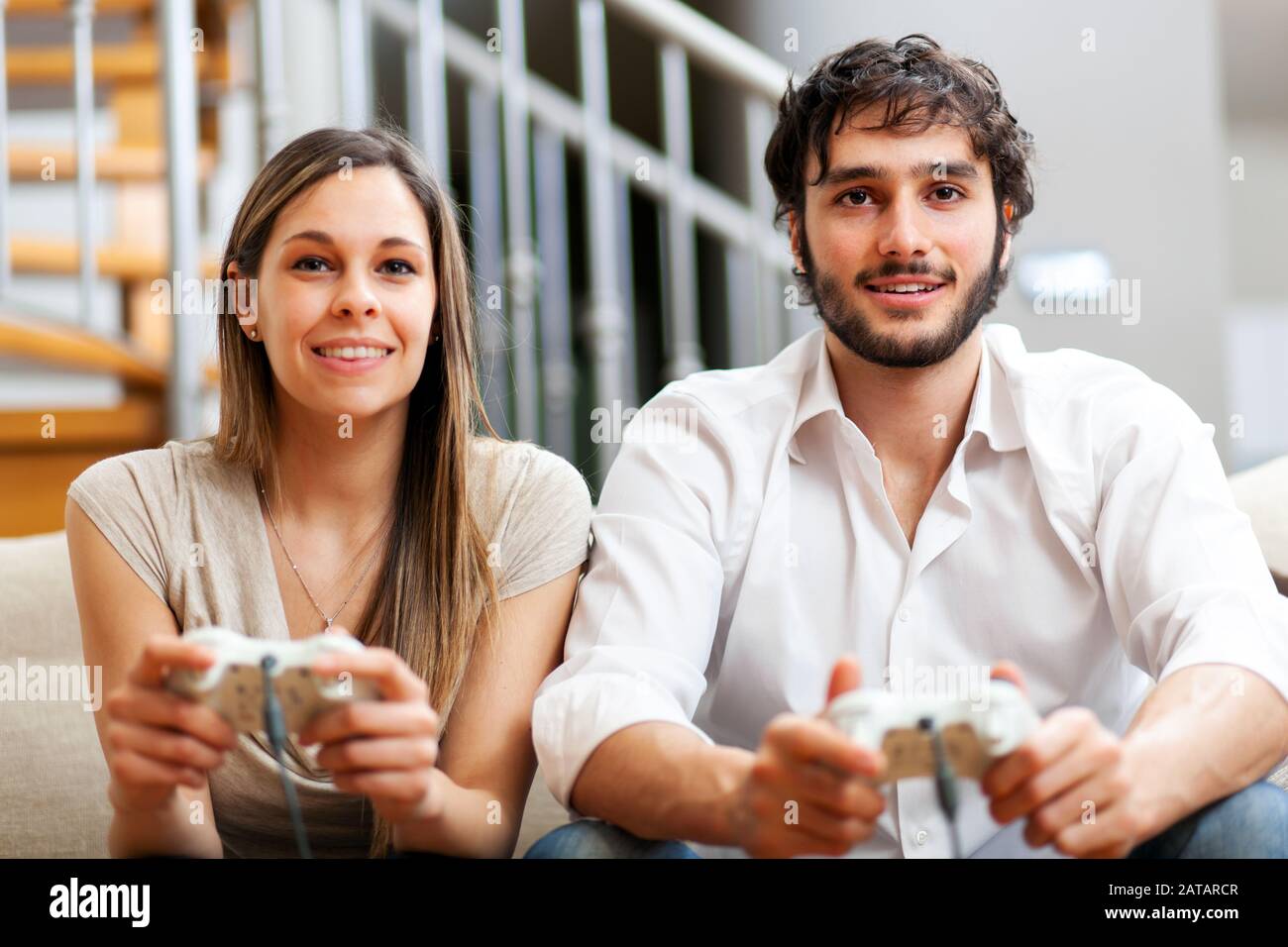 Young couple playing video games hi-res stock photography and images ...