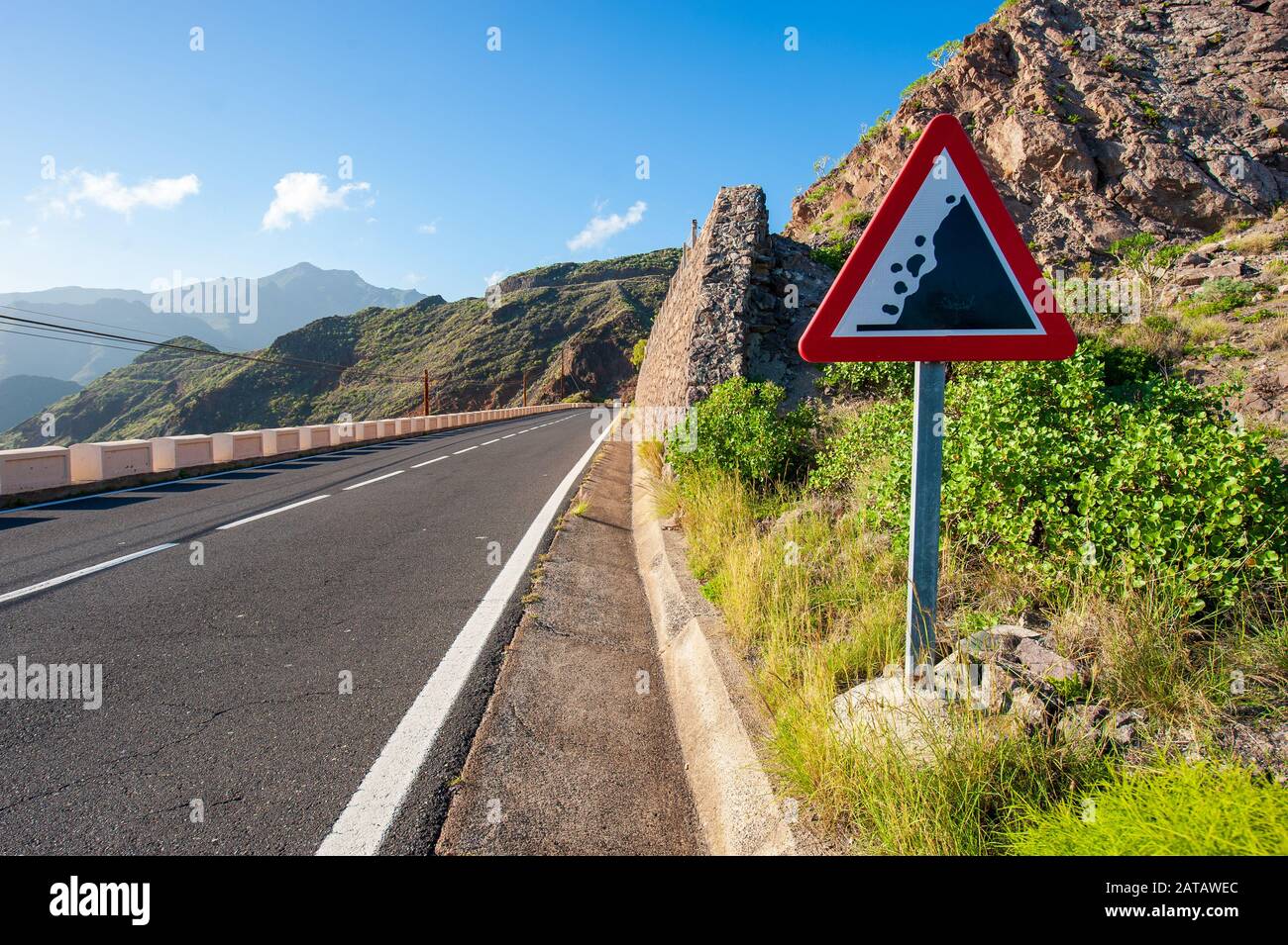 A falling rocks sign on a road on the Canary Island Tenerife. Stock Photo