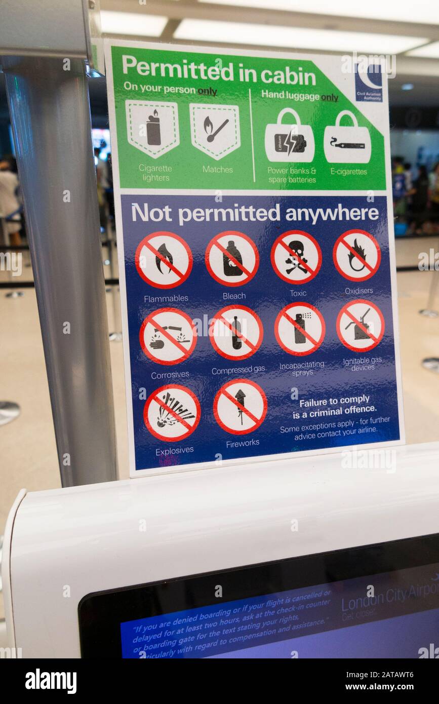 Sign at self check in point at an airport showing a list of prohibited items which are not allowed to be carried in luggage. London City airport, London, UK. (112) Stock Photo