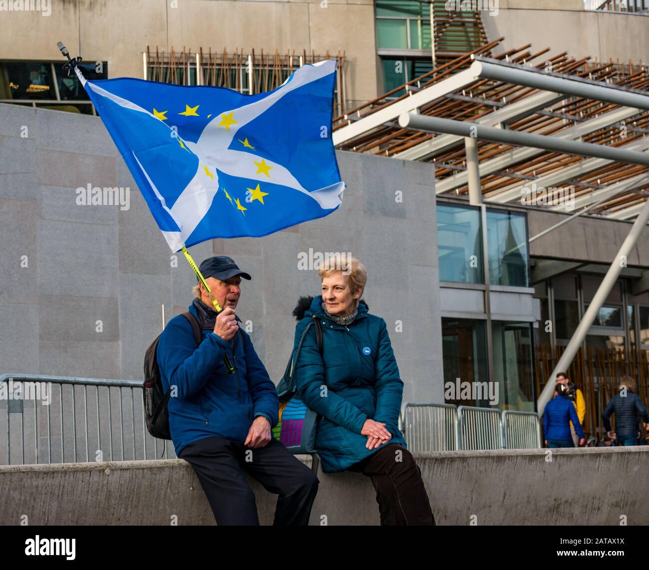 Anti-Brexit senior protestors at Scottish parliament with EU stars flag and saltire on Brexit Day, Holyrood, Edinburgh, Scotland, UK Stock Photo