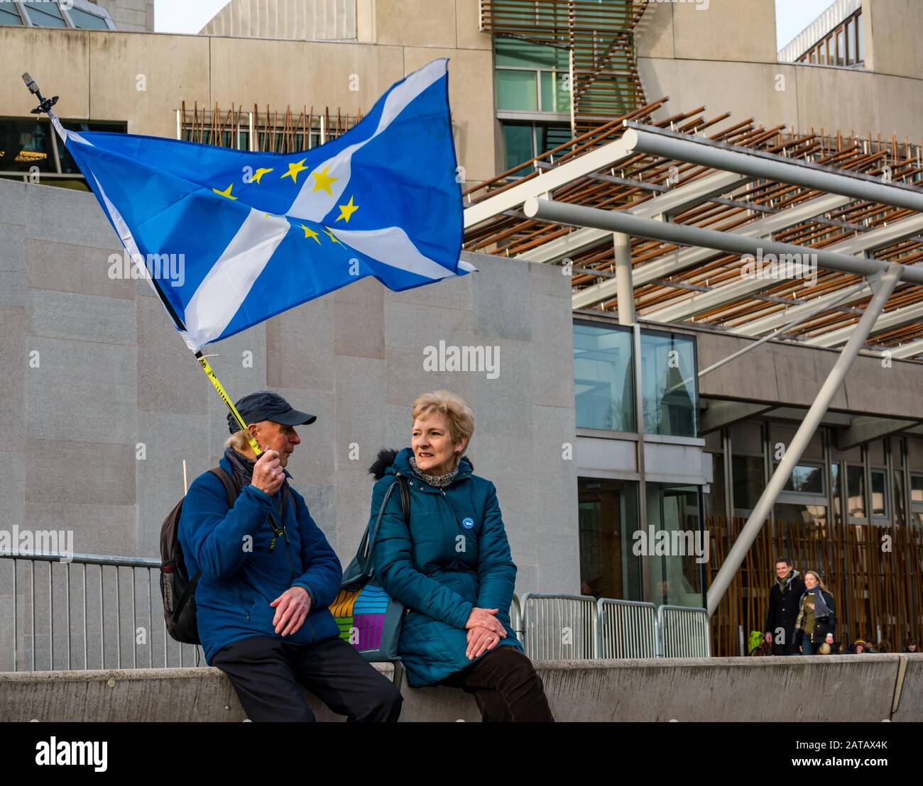 Anti-Brexit senior protestors at Scottish parliament with EU stars flag and saltire on Brexit Day, Holyrood, Edinburgh, Scotland, UK Stock Photo