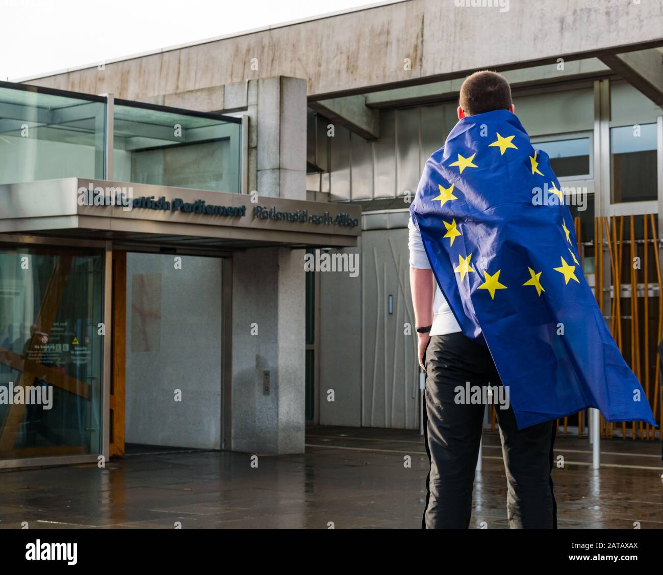 Schoolboy draped in European Union flag at Scottish parliament on Brexit Day, Holyrood, Edinburgh, Scotland, UK Stock Photo