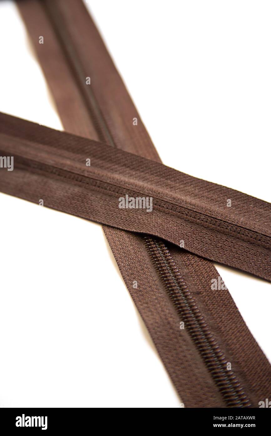 Brown zipper for shoes, backpack or bag isolated on white background Stock Photo