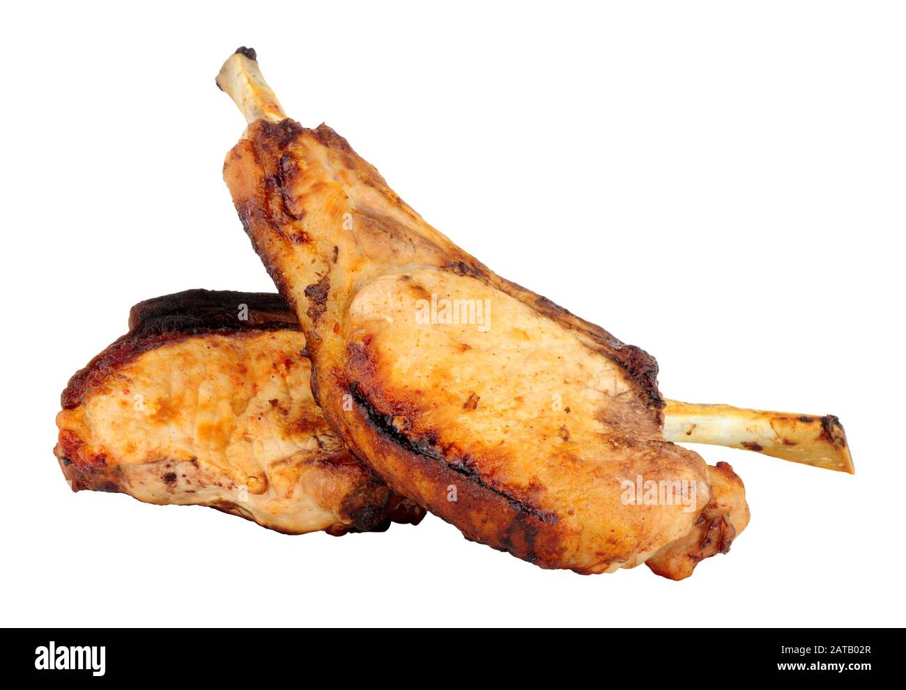 Two grilled tomahawk pork chops isolated on a white background Stock Photo