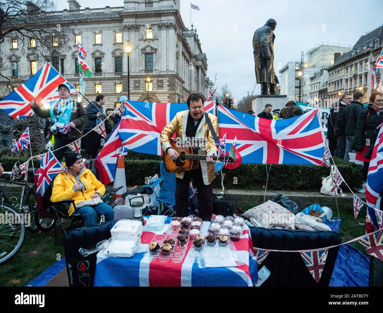 Brexit day 31st Jan 2020  in Parliament square, London, England. A man sings and plays the guitar. Stock Photo
