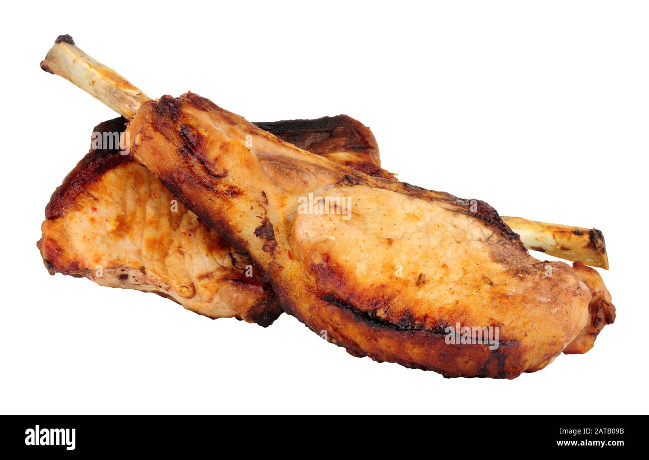 Two grilled tomahawk pork chops isolated on a white background Stock Photo