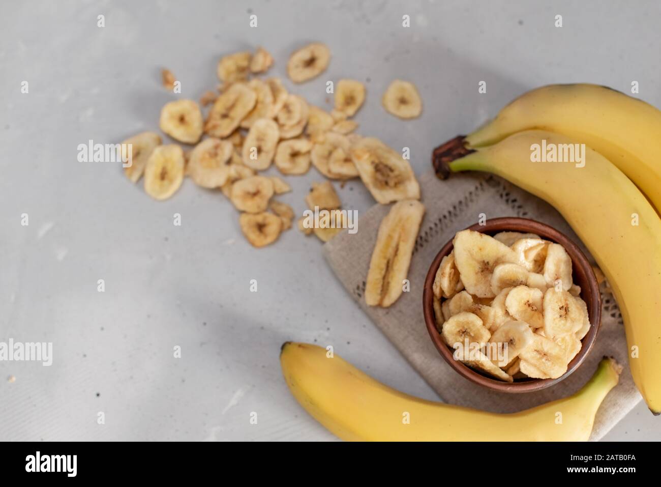 Banana This is a close up shot of a bowl full of dried banana chips