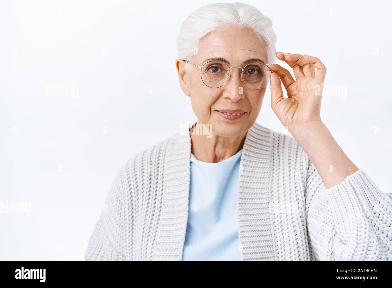 Health, insurance and retirement concept. Cheerful elegant old lady in