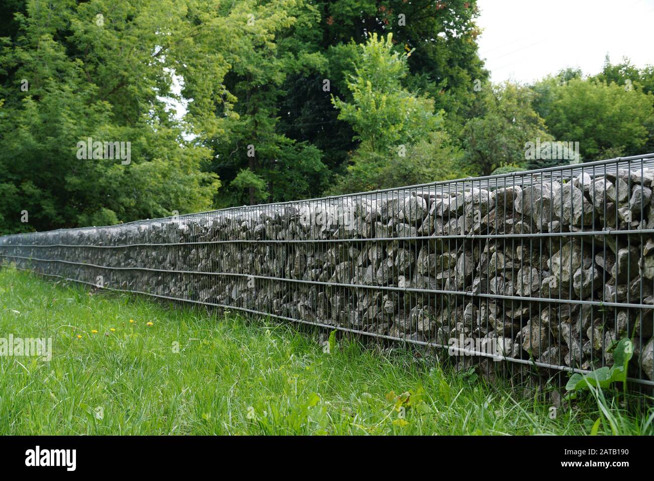 In the park. An effective, quick to install wall made of gabions Stock