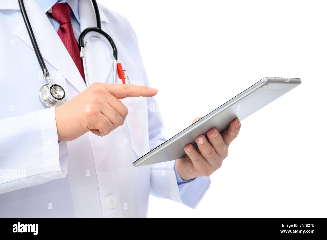A side view of a male doctor using a tablet on a white background Stock ...