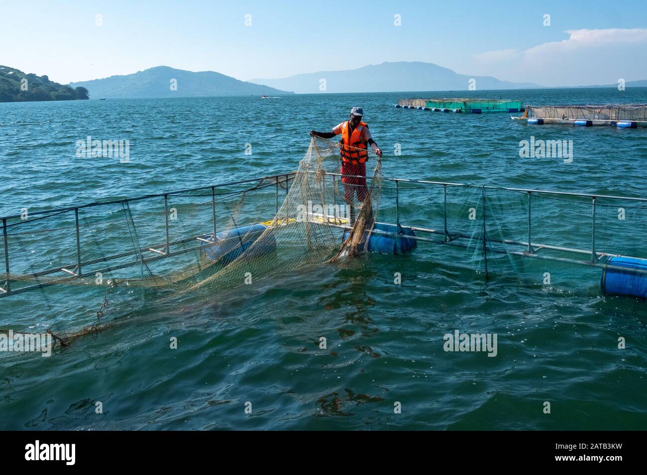 An employee of Victory Farms, the largest fish farmer in Kenya, fixes