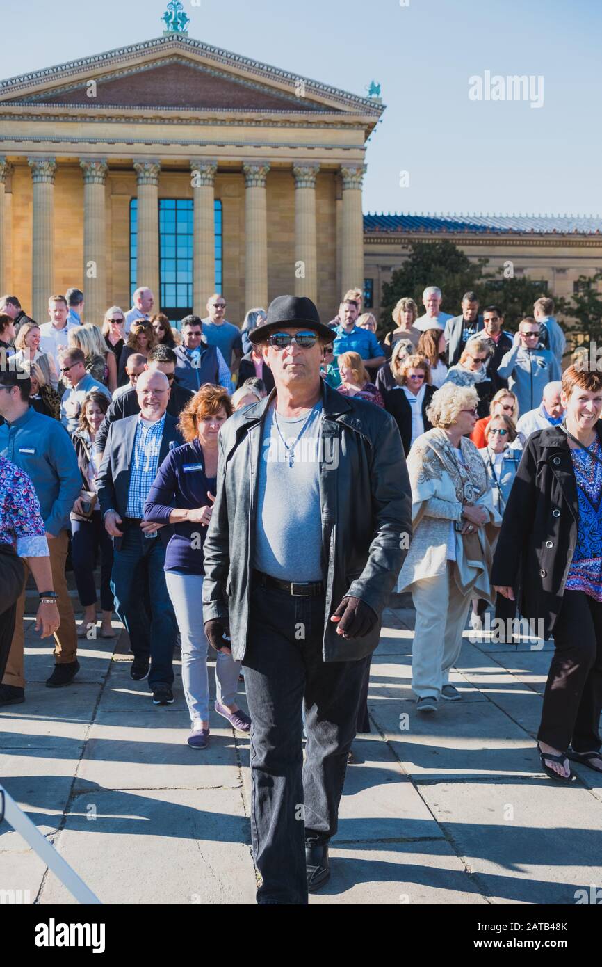 PHILADELPHIA, PENNSYLVANIA - OCTOBER 4, 2019: Local Rocky Balboa look-alike gathers huge crowd at the steps of the Philadelphia Museum of Art Stock Photo