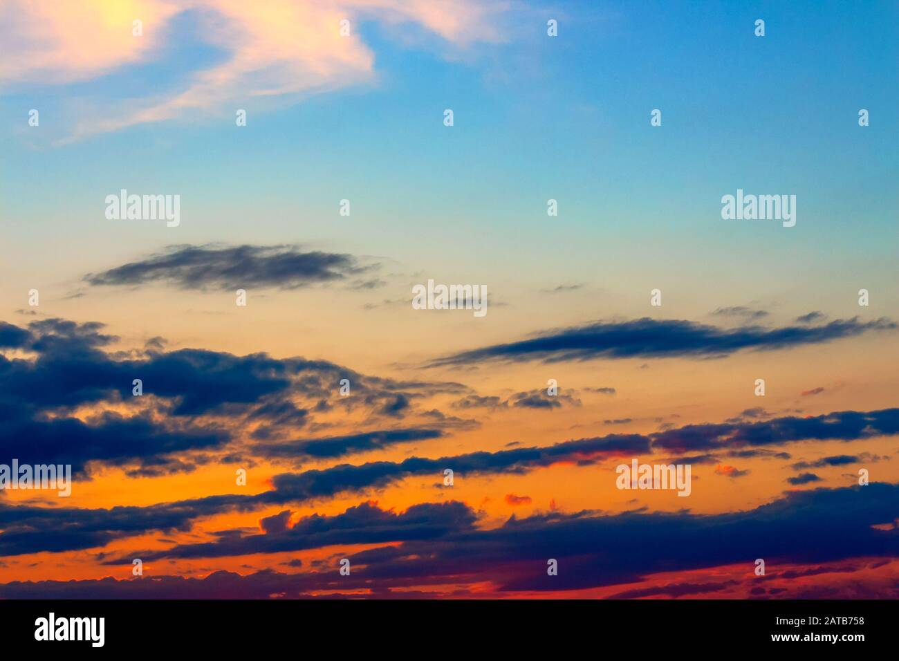 orange sunset sky with clouds. beautiful nature background Stock Photo ...