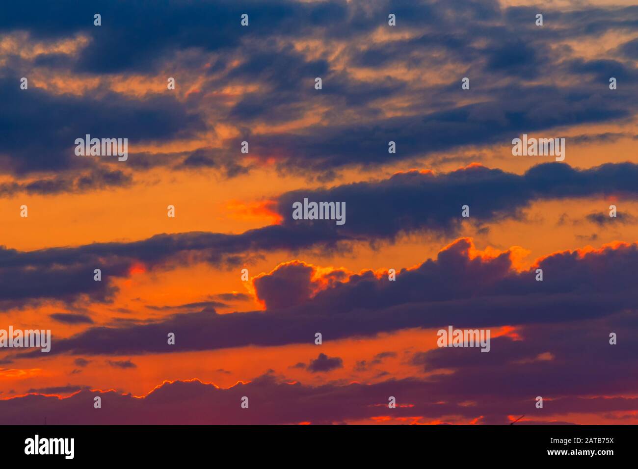 orange sunset sky with clouds. beautiful nature background Stock Photo