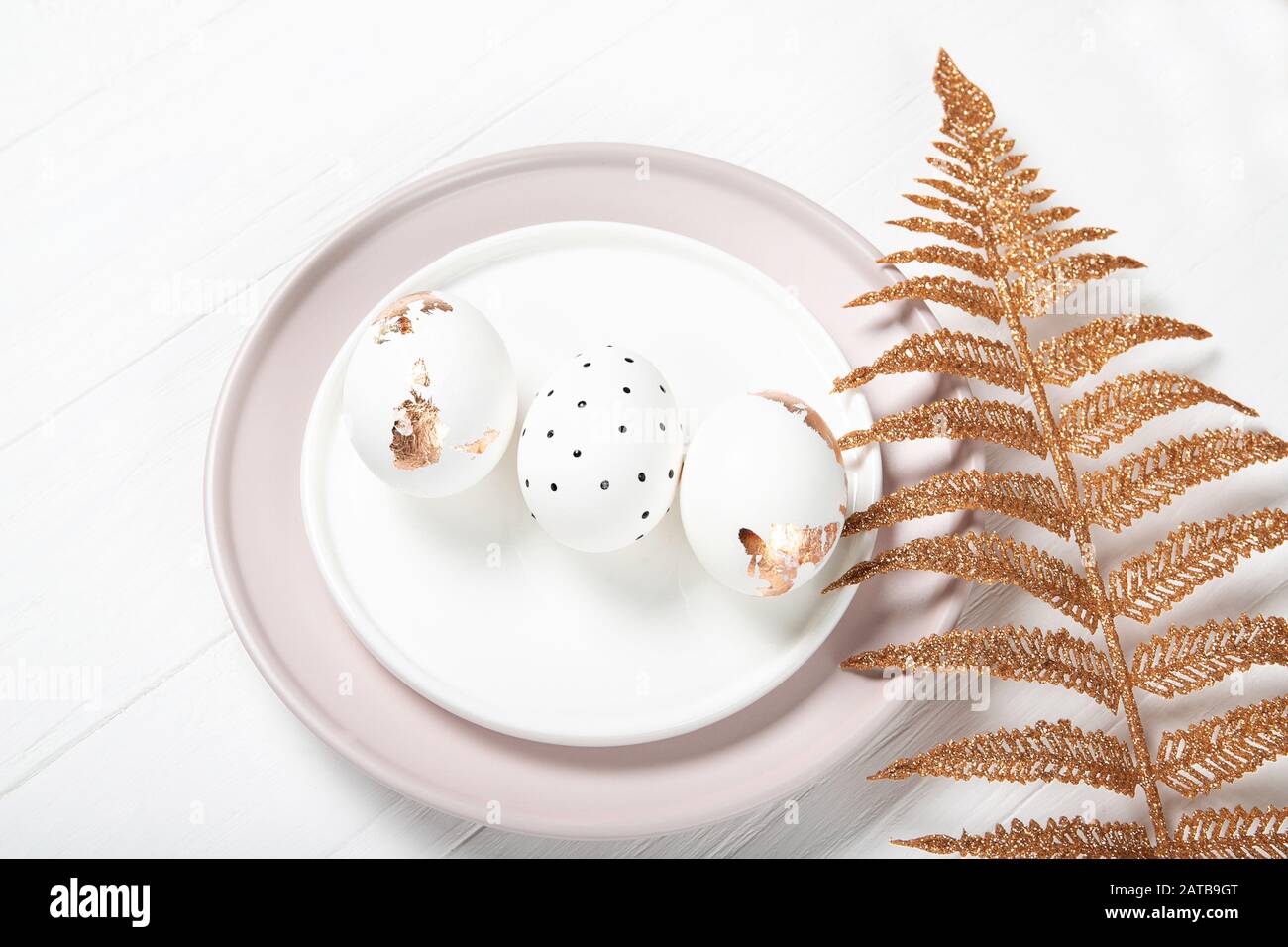Beautiful easter composition. Easter eggs on a plate Stock Photo