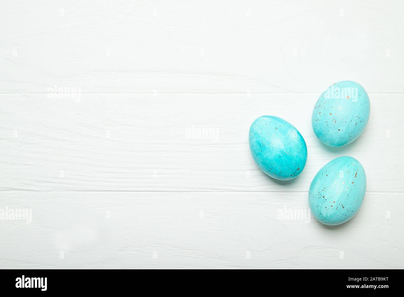 Blue Easter eggs with gold splashes Stock Photo
