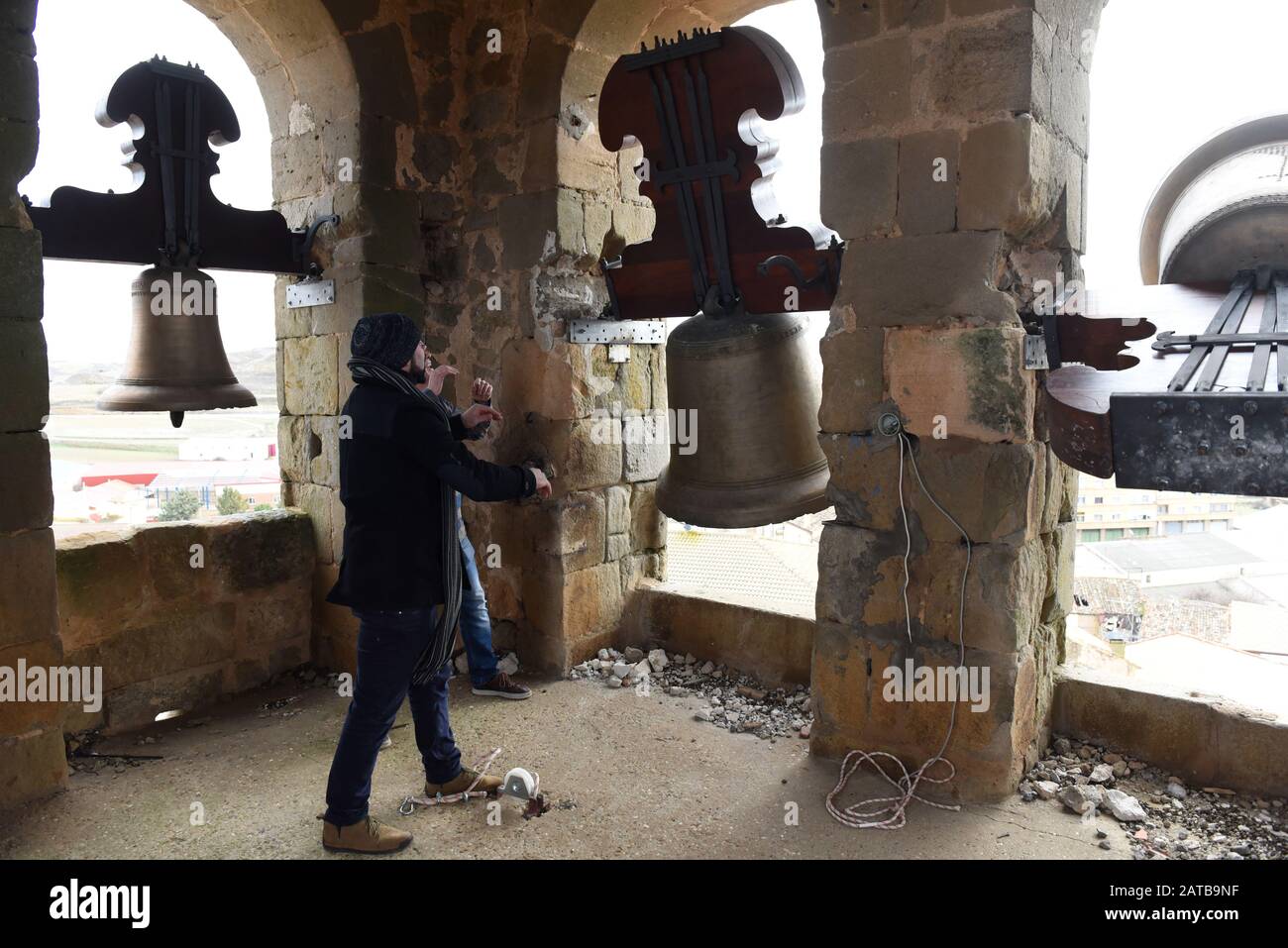 A man rings a bell inside a church tower during the protest in Gómara