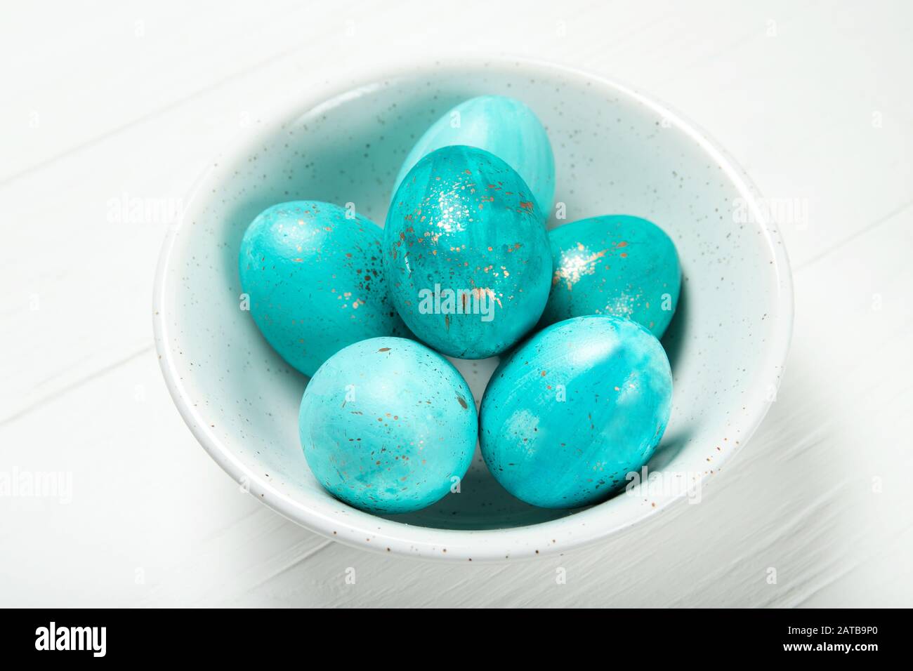 Easter eggs in a plate on a white background Stock Photo
