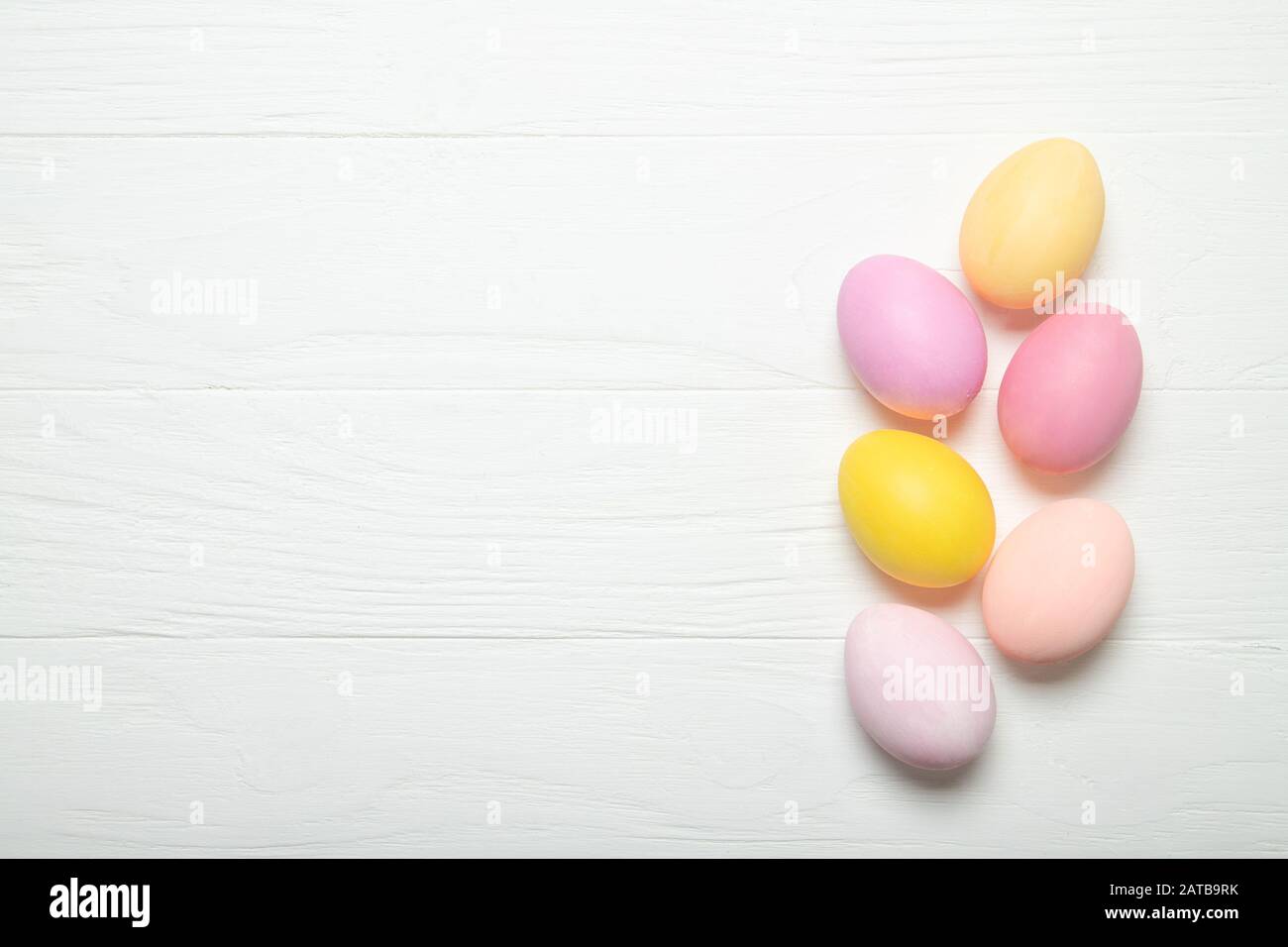 Multi-colored Easter eggs on a white background. With place for text. Stock Photo
