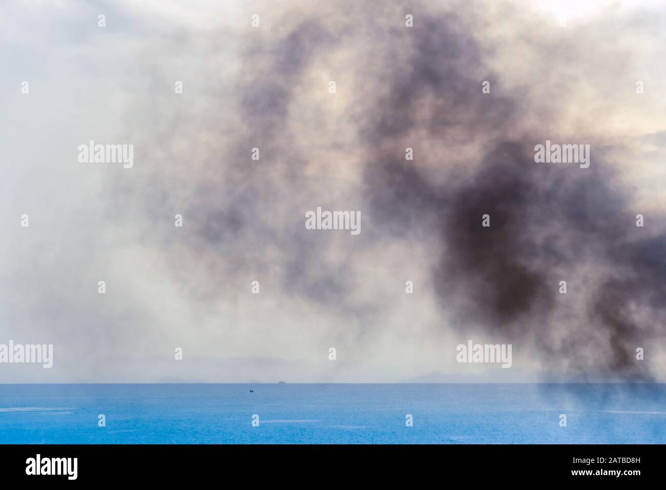 Exhaust pipe of ferry boat with black thick smoke coming out and sky ...