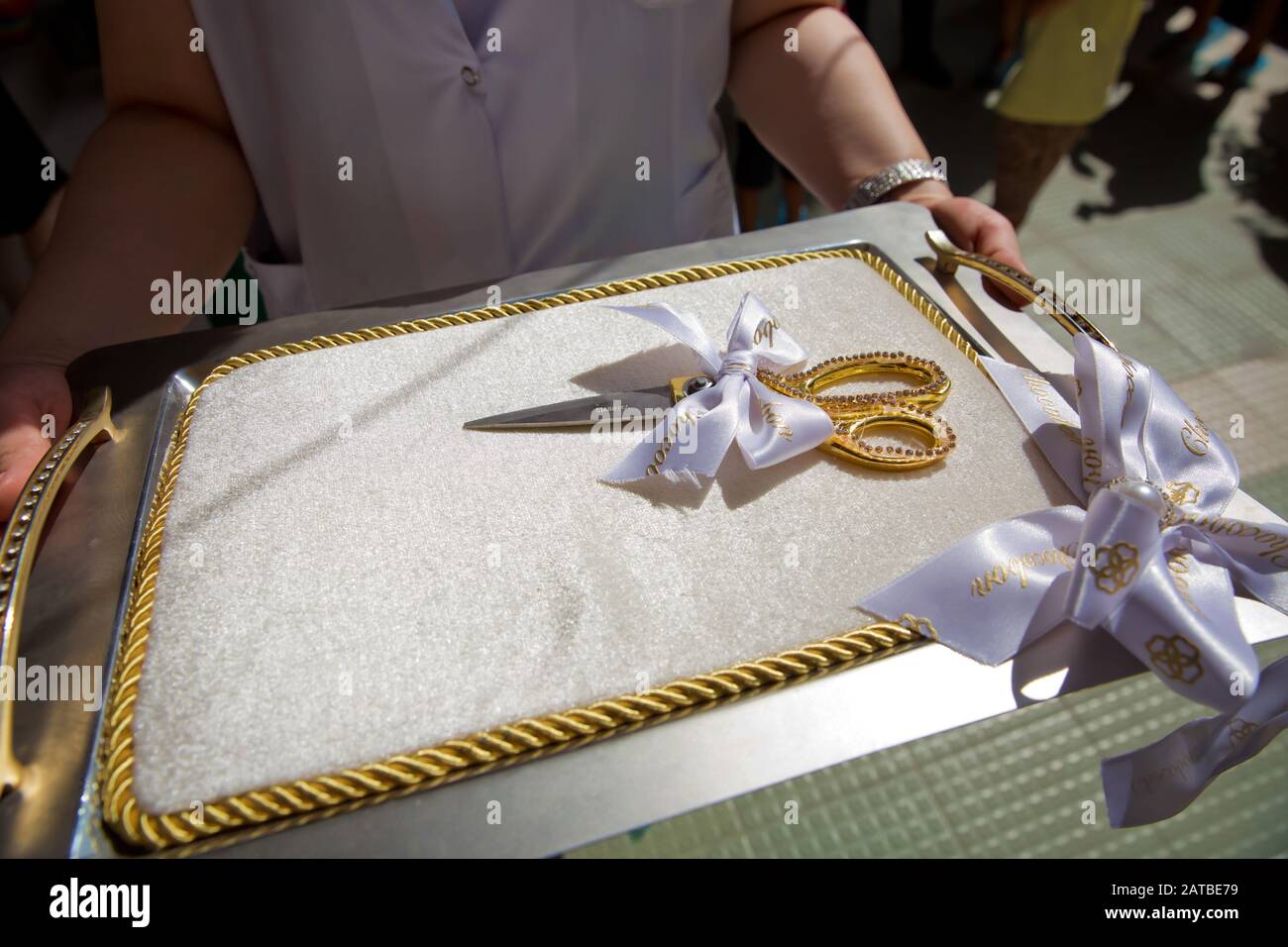 https://c8.alamy.com/comp/2ATBE79/scissors-for-the-ceremonial-ribbon-cutting-at-the-opening-ceremony-on-the-white-cushion-and-tray-with-handles-2ATBE79.jpg