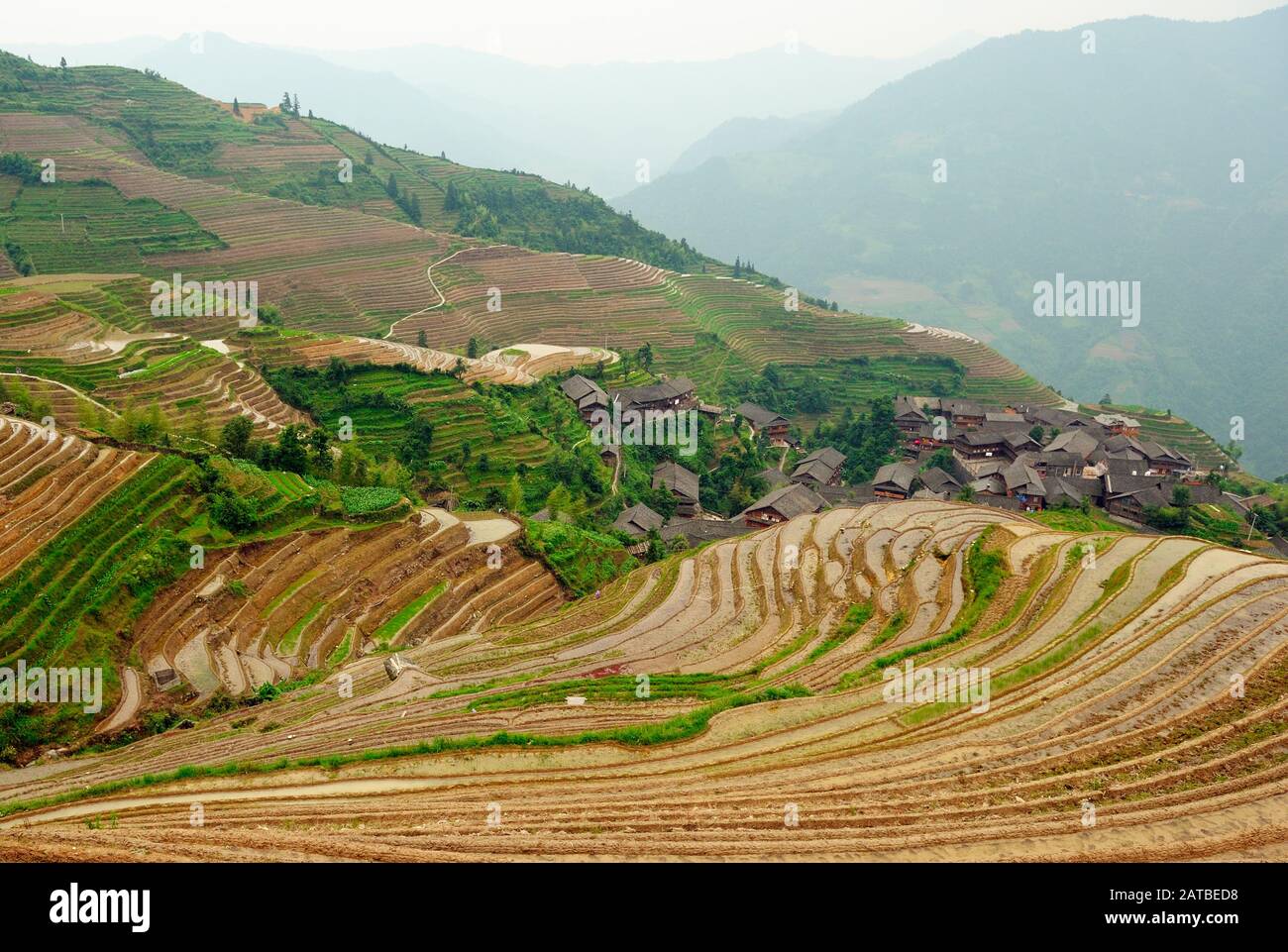 Village and rice terraces fields in Chinese mountains Stock Photo - Alamy