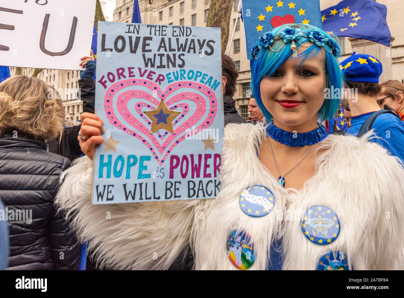 Madeleina Kay, EU Supergirl, on Brexit Day, 31 January 2020, in London, UK. Young female pro EU campaigner with love placard. Love wins Stock Photo