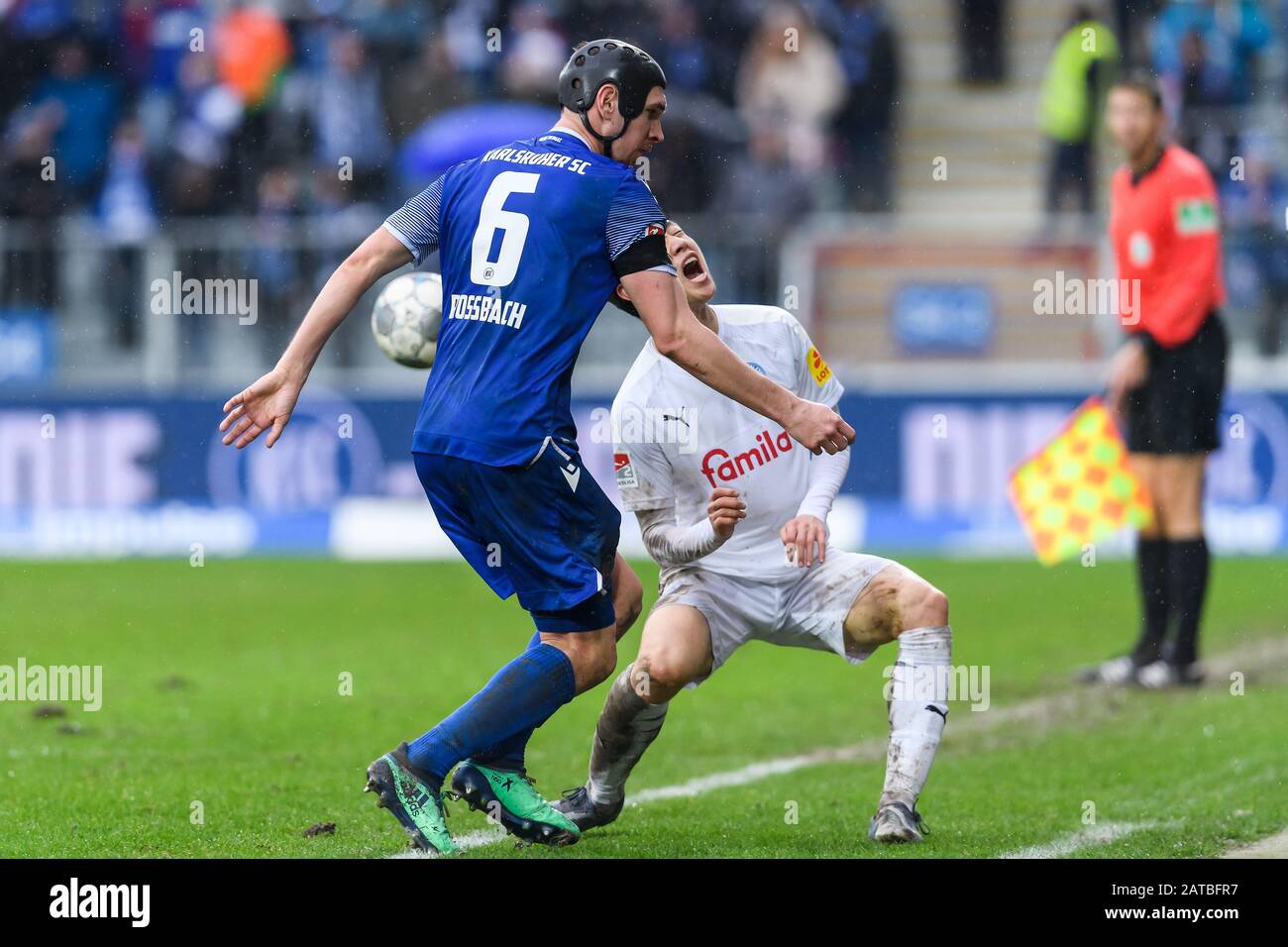 Karlsruhe, Deutschland. 01st Feb, 2020. Damian Rossbach (KSC) in duels with Jae-sung Lee (Holstein Kiel). Damian Rossbach (KSC) got the red card after this foul. GES/Football/2nd Bundesliga: Karlsruher SC - Holstein Kiel, 01.02.2020 Football/Soccer: 2nd Bundesliga: KSC vs Holstein Kiel, Karlsruhe, February 1, 2020 | usage worldwide Credit: dpa/Alamy Live News Credit: dpa picture alliance/Alamy Live News Stock Photo