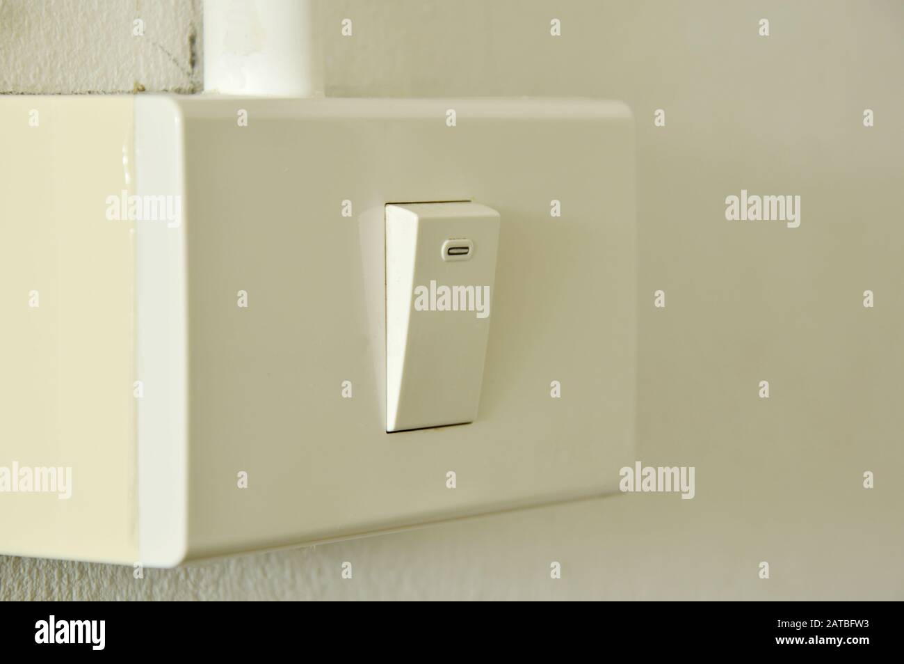 toggle switch in plastic box on the wall Stock Photo