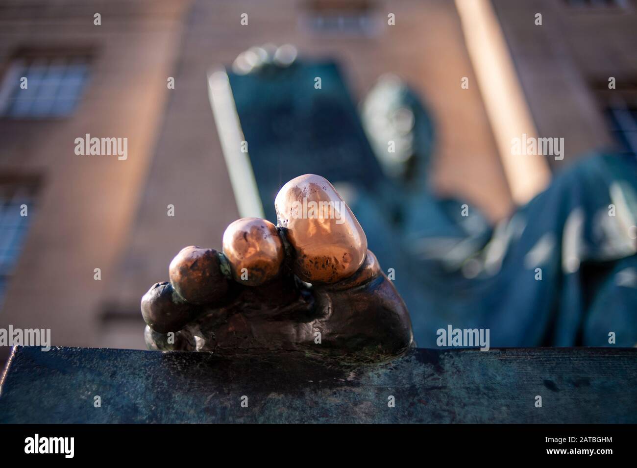 Feet and toe close up of Hume sculpture on Edinburgh Royal mile. Edinburgh cityscape/travel