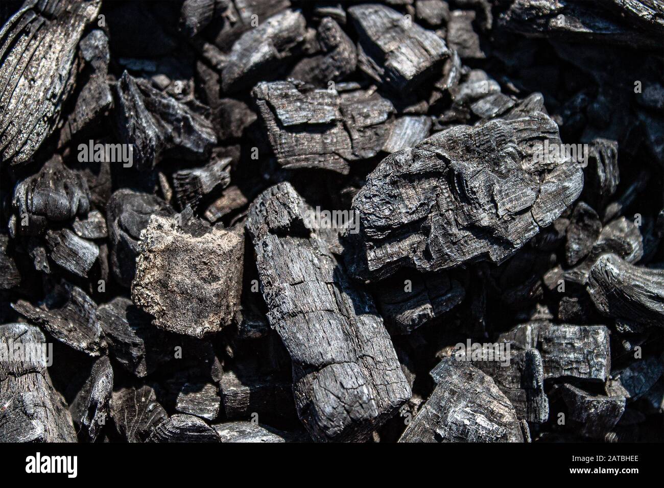 Ash of a burnedout fire. Background of burnt firewood. Background with