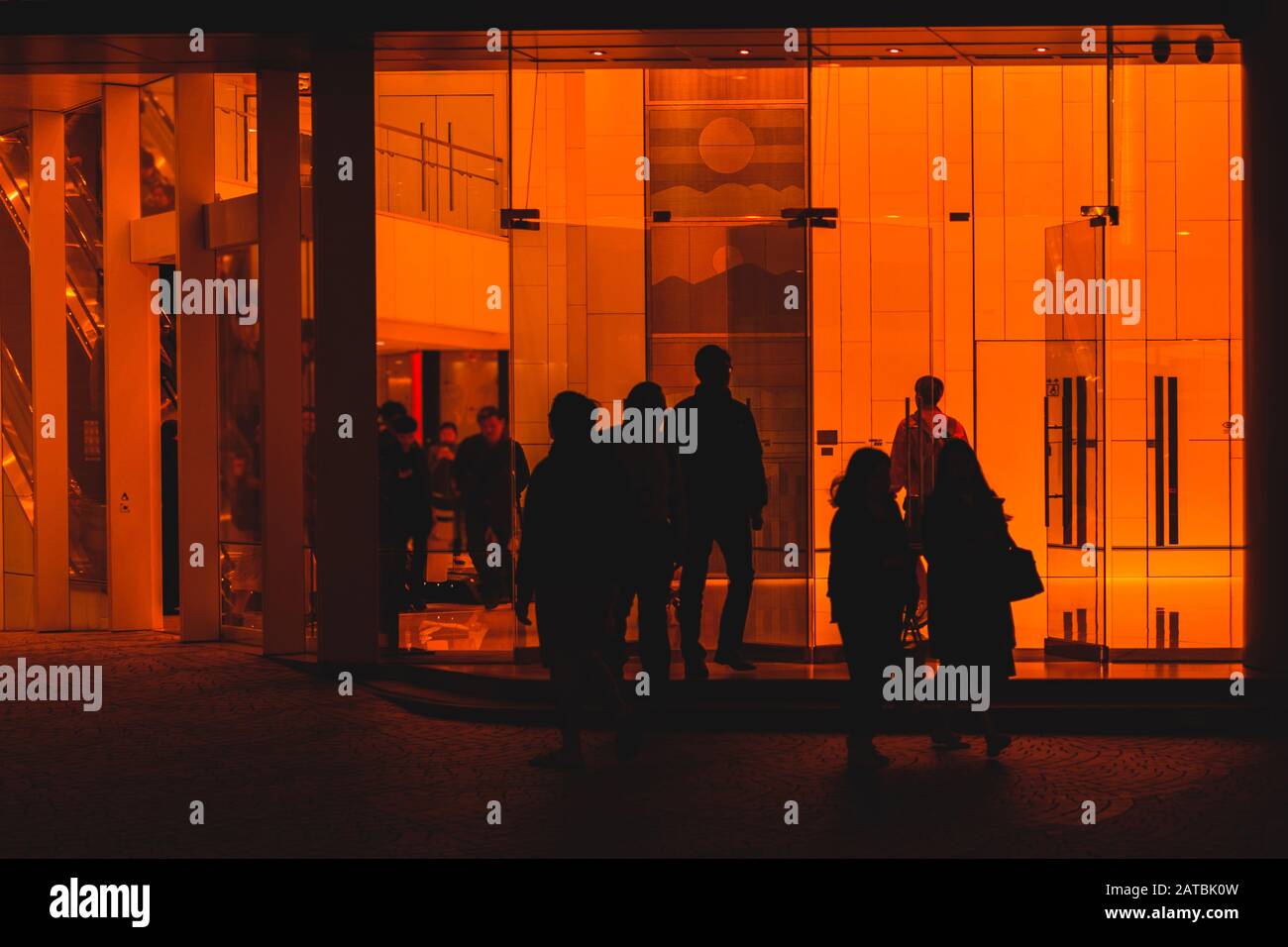people leaving office building, silhouettes of  people - Stock Photo
