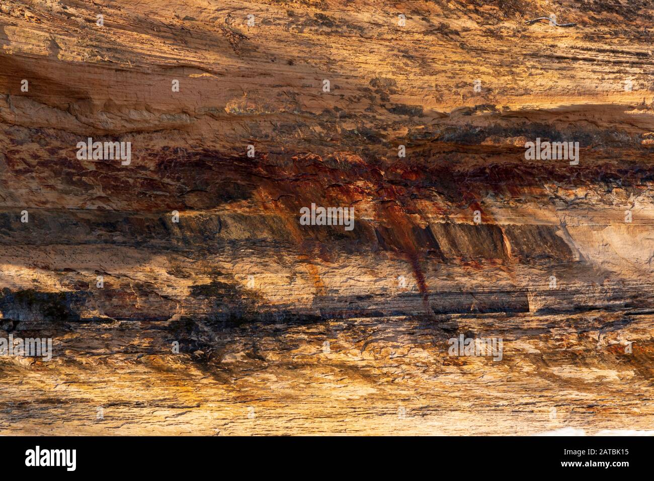 Pitted Rocks Cliffs Stained Cliffs of Pictured Rocks National Forest Stock Photo - Alamy