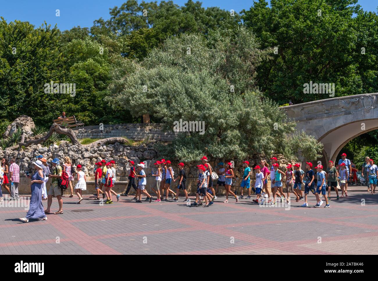 Sevastopol, Crimea - July 3, 2019. Tourist excursion group of children on the waterfront Stock Photo