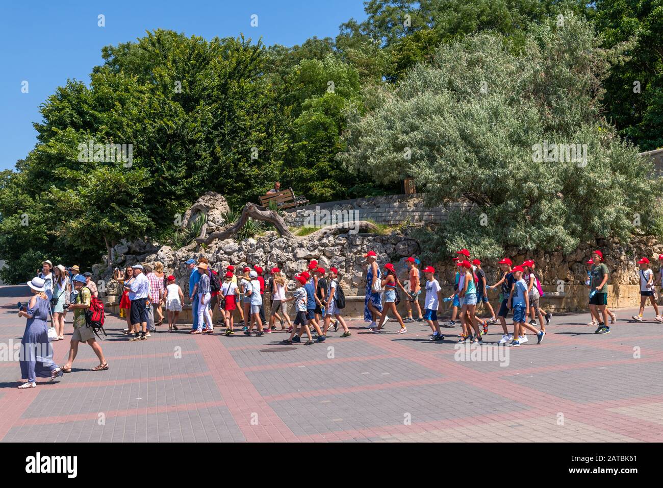 Sevastopol, Crimea - July 3, 2019. Tourist excursion group of children on the waterfront Stock Photo