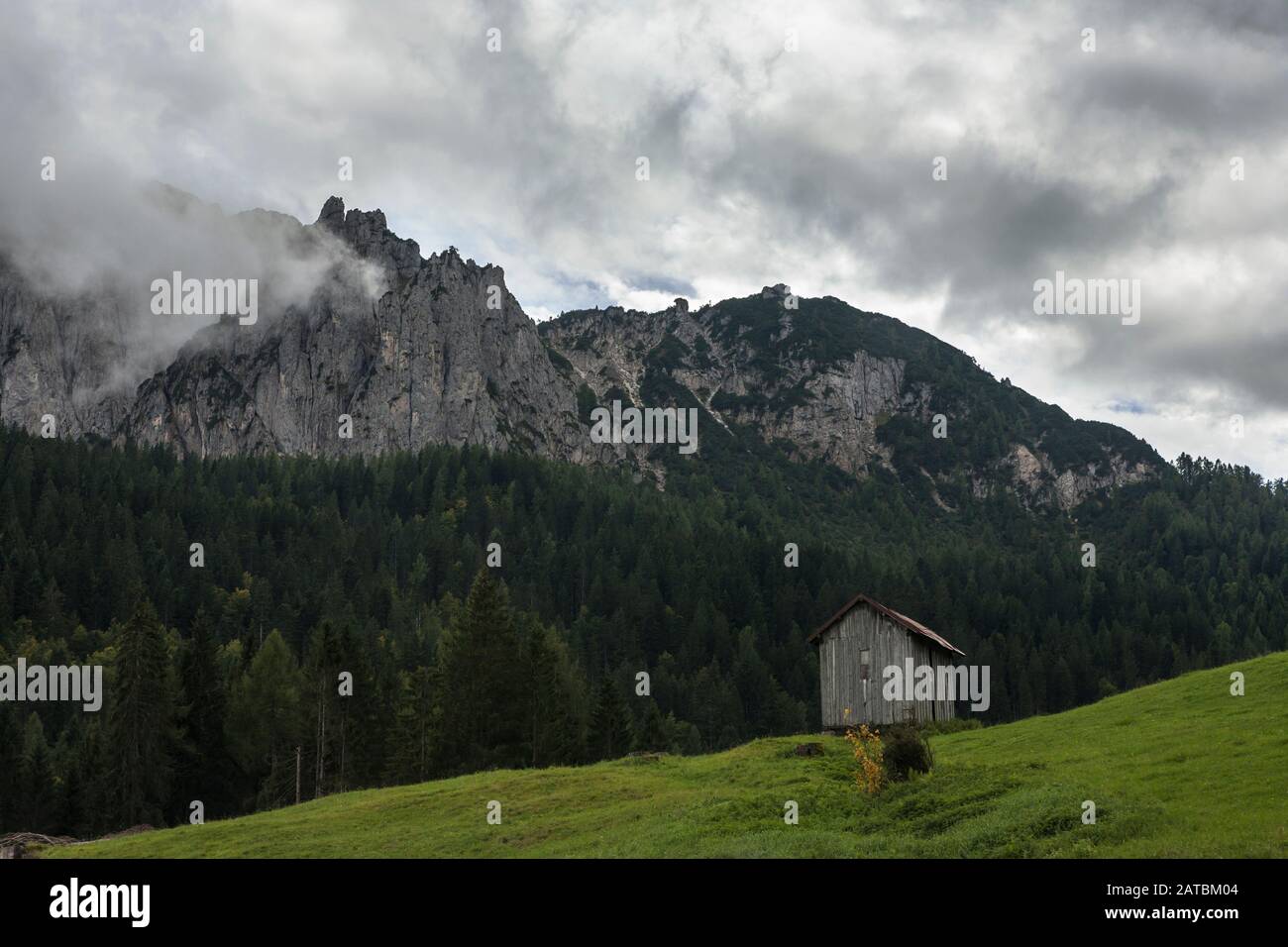 Lone alpine hut at the top of the Passo di Cereda, with Cima Palughet beyond, Cimonega Range, Dolomites, Trentino-Alto Adige, Italy Stock Photo