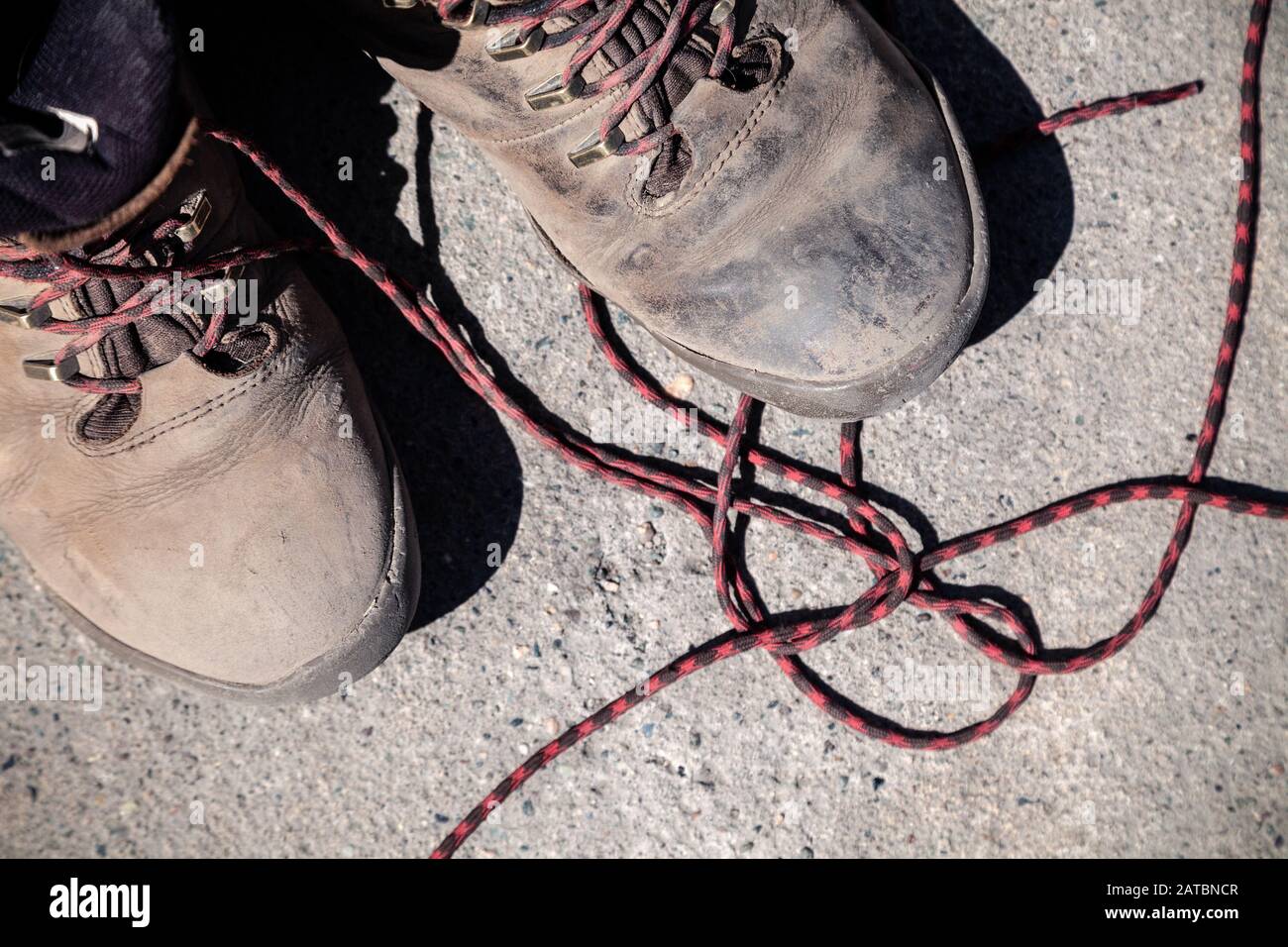 Image showcasing Pair of favorite, worn and dirty high-altitude trekking boots covered ...